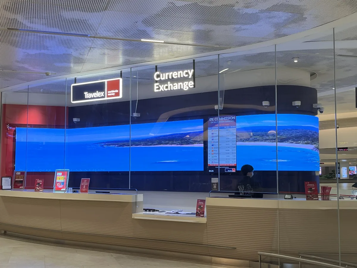 Travelex Currency Exchange — view 2 — Flexible & Curved installation by ETA Visual